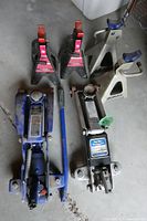 All items laid out: two floor jacks, four axle stands