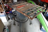 Full view of table saw showing top, stand and motor