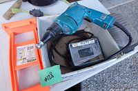 Makita drywall screwdriver, screw box, Stanley carrier, knee pad in cardboard tray