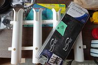 White plastic rod racks and BoatBuckle vertical mount rod holder