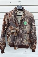Front view of fleece-lined camo jacket on hanger