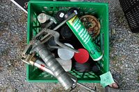 Crate with grease guns and lubricant containers