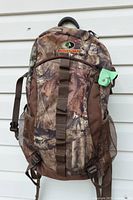 Front view of Mossy Oak camo backpack with logo and straps visible