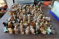 Wide view of bulk group of Wade figurines on tabletop