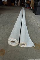 Two rolls of Tyvek HomeWrap laid on floor showing lengths