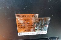 Serial and specification label showing model, 12 V and 10 W data