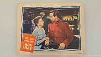 Full view of one lobby card showing actors and layout