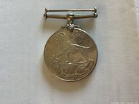 Obverse showing lion over dragon with 1939 1945