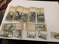 Overview of all hook display cards and packs on table