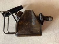 Full side view showing triangular brass body, nozzle, burner tube and handle