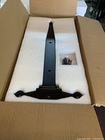 Hinge in foam inside shipping box with hardware packet