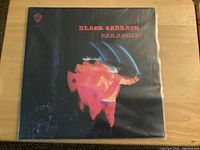Front sleeve of Black Sabbath Paranoid LP in protective sleeve