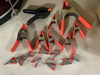 All 18 spring clamps arranged to show varying sizes and materials