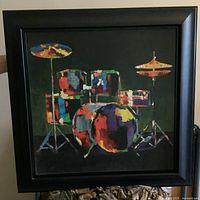 Full view of framed print showing drum set and black frame