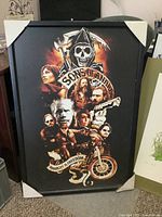 Full view of framed Sons of Anarchy print with cardboard corner protectors