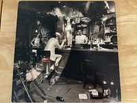 Front of album jacket showing bar scene artwork