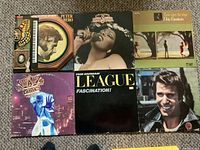 Front jackets of all six LP records arranged in two rows