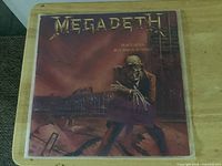 Front jacket depicting skeleton holding For Sale sign