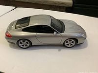 Left side view of silver Porsche 911 diecast model