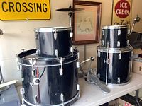 Overall view showing bass drum, mounted tom on top, floor tom, cymbal and hardware