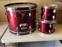 Front view of bass drum and two toms showing size comparison and finish