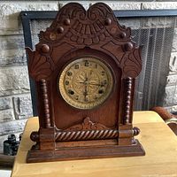 Full view of Waterbury carved oak mantel clock showing overall design and size reference
