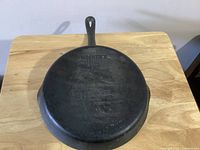 Top view of skillet base showing brand markings and overall finish