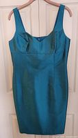 Front view of teal Georgiou Studio sleeveless silk dress