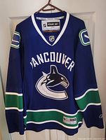 Front view of Vancouver Canucks blue Reebok jersey