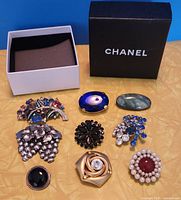 All nine brooches with Chanel box