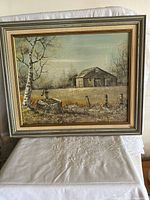 Full view of framed landscape painting