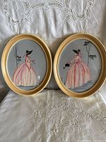 Both framed watercolor paintings side by side