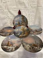 Six collector plates front view showing artwork variety