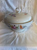 Tureen with lid front view showing floral design and ribbed body