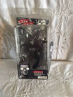 Front view of sealed NECA Kevin figure in clamshell