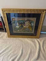 Front view of framed painting showing artwork, frame style and dimensions context