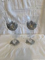 Two glass wine glasses with pewter floral overlay front view
