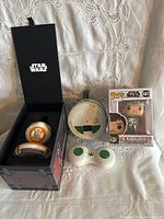 Overall lot showing BB-8 components in open case, controller, disc head, and boxed Funko Pop figure