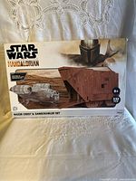 Front of boxed Star Wars Mandalorian Razor Crest & Sandcrawler paper model kit