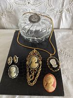 Front view showing all six cameo jewelry pieces