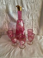 Full set showing decanter with stopper and five glasses