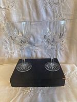 Front view of two crystal wine glasses on box showing overall design