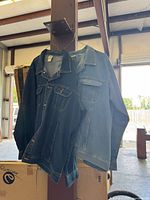 Both denim jackets hanging to show fronts, colors visible