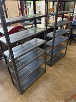 Both aluminum shelving units side by side