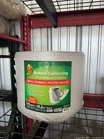 Front view of labelled Duck bubble wrap roll on shelf
