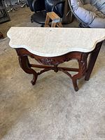 Full view of marble top wood end table showing overall design and dimensions