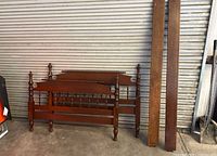 Bed frame components leaning against wall