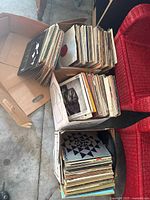 Three cardboard boxes filled with vinyl LP records