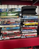 Wide shot of both DVD stacks and disc wallet on shelving