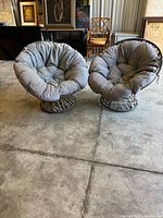 Front view of both Papasan chairs with gray cushions